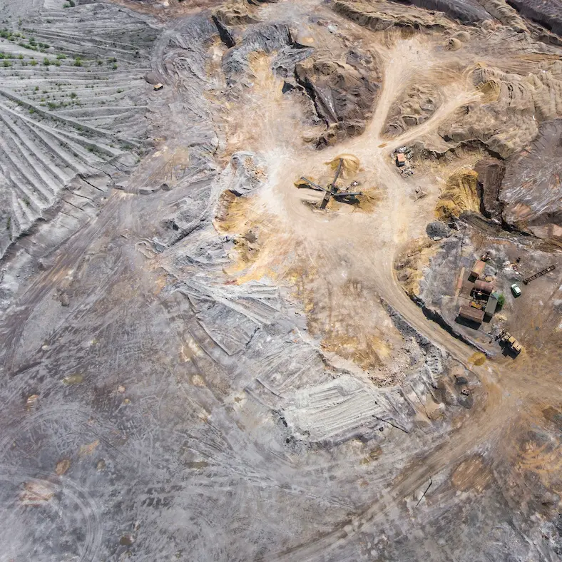 Aerial view of abandoned open pit mine site similar to Mount Nansen Yukon